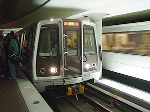 A Red Line train services Metro Center, one of...